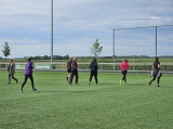 Laatste training S.K.N.W.K. JO11-1JM (partijtje tegen de ouders) van maandag 27 mei 2024 (3/137)